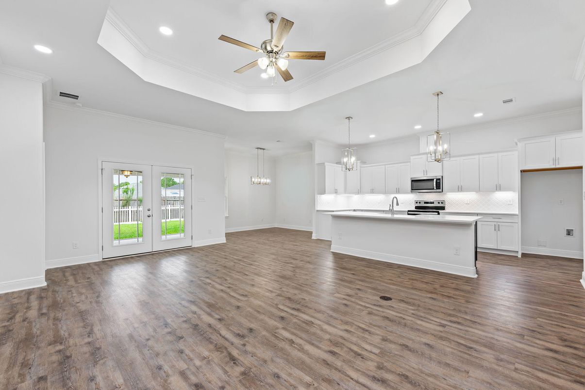 Chandelier, Empty room, Interior, Kitchen, Pendant Lights, Recessed Lighting, Stainless Steel Appliances, Wood Texture Flooring