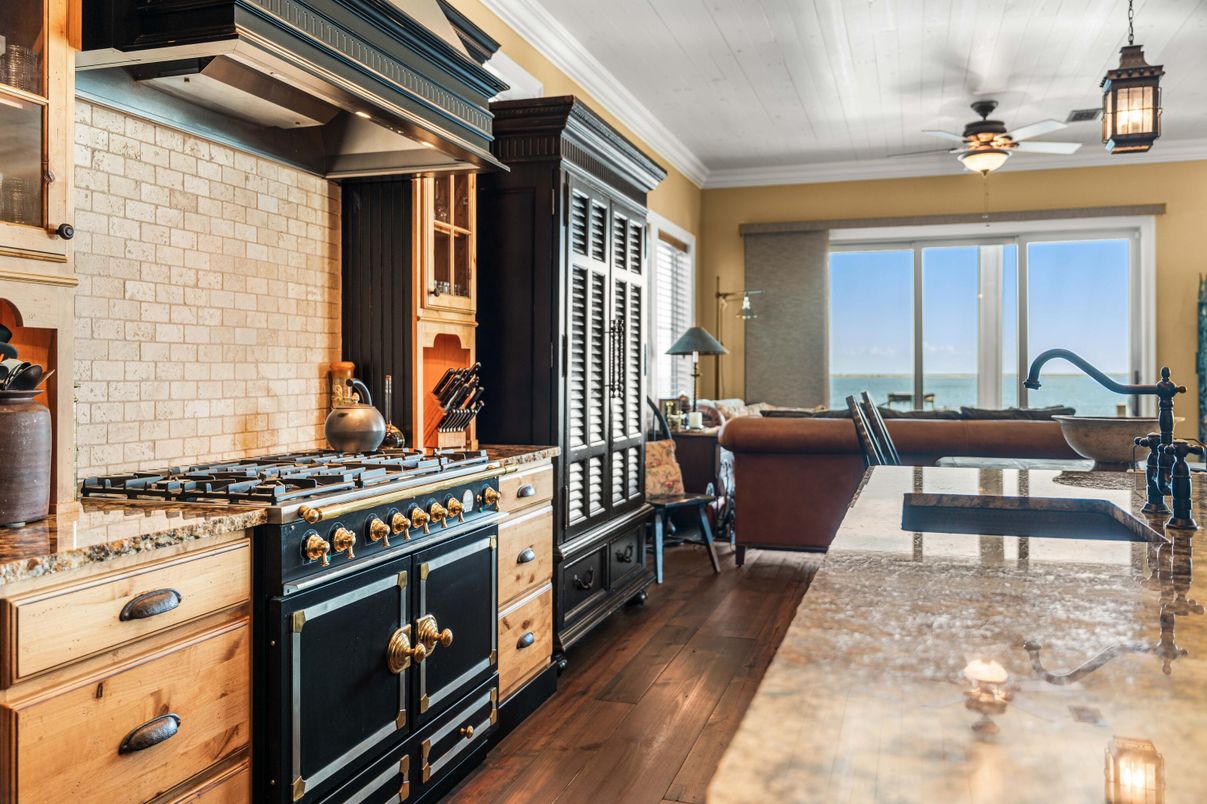 Interior, Kitchen, Living room, Pendant Lights, Stainless Steel Appliances, Stone Walls, Water, Wood Texture Flooring