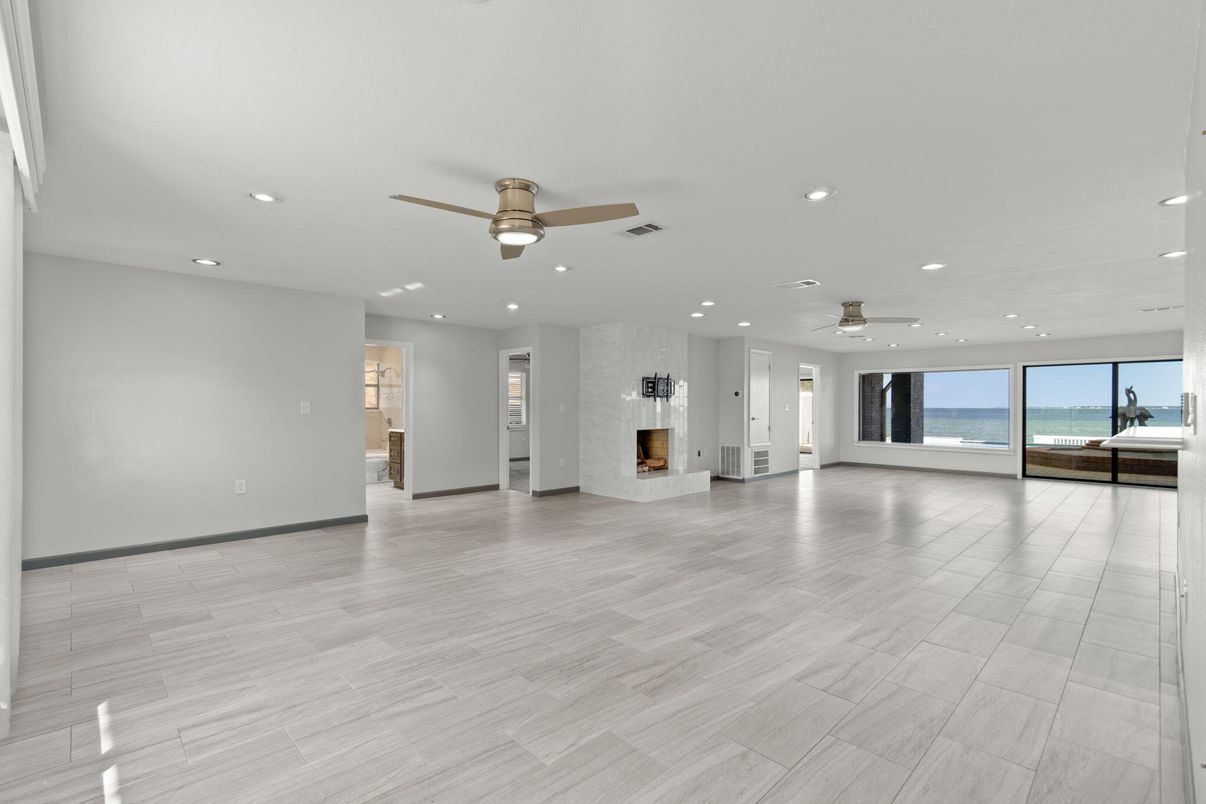 Empty room, Fireplace, Interior, Recessed Lighting, Water, Wood Texture Flooring