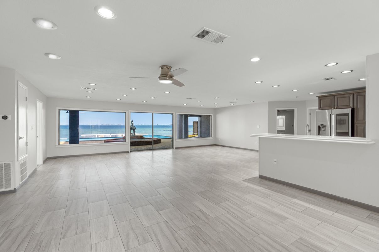 Empty room, Interior, Kitchen, Recessed Lighting, Stainless Steel Appliances, Water, Wood Texture Flooring