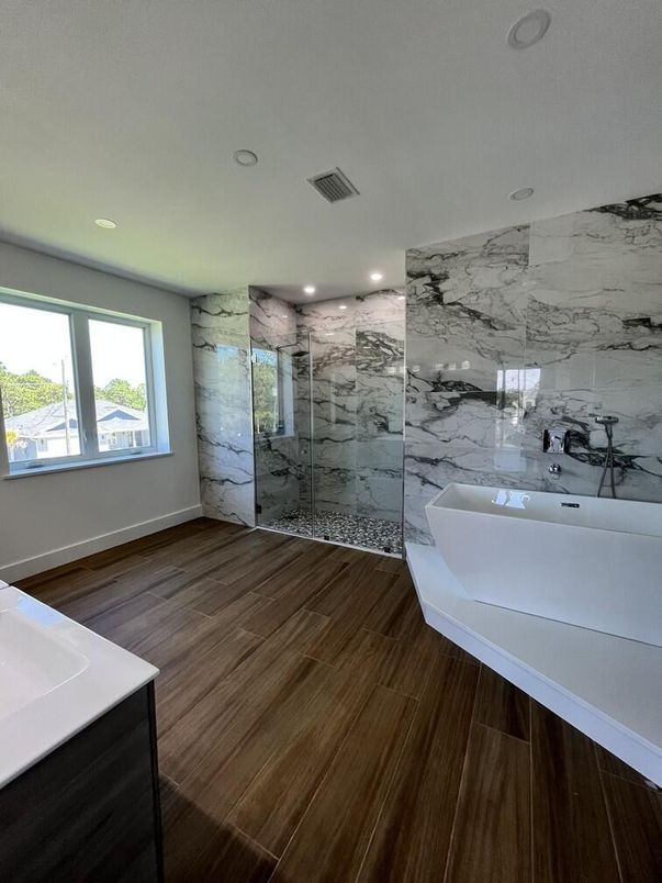 Bathroom, Glass Shower, Interior, Marble Walls, Recessed Lighting, Wood Texture Flooring