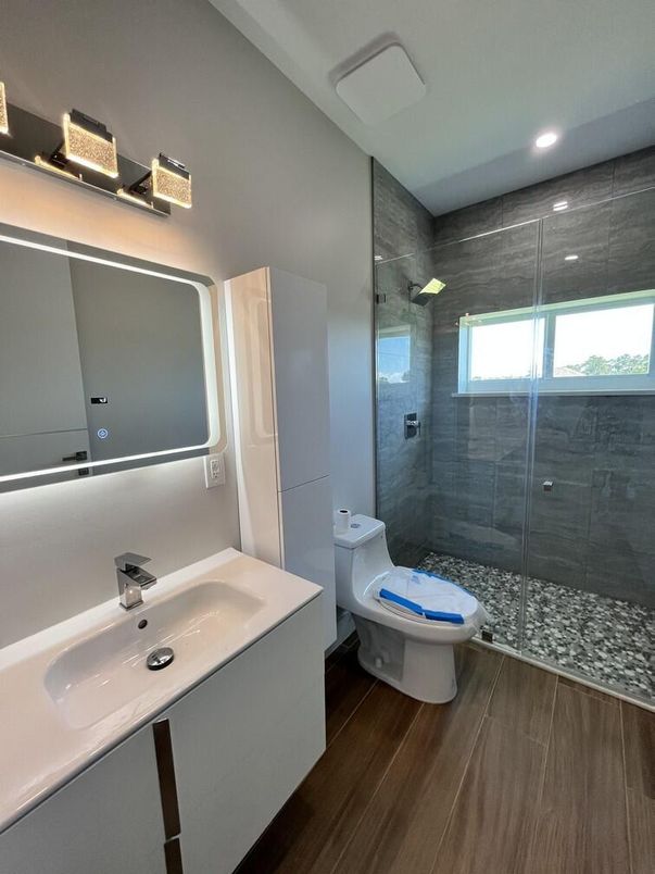 Bathroom, Dual Sink Vanities, Glass Shower, Interior, Recessed Lighting, Wood Texture Flooring