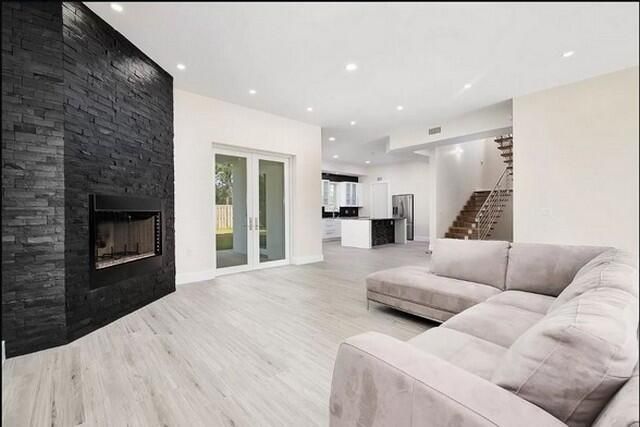 Fireplace, Interior, Kitchen, Living room, Recessed Lighting, Stone Walls, Wood Texture Flooring