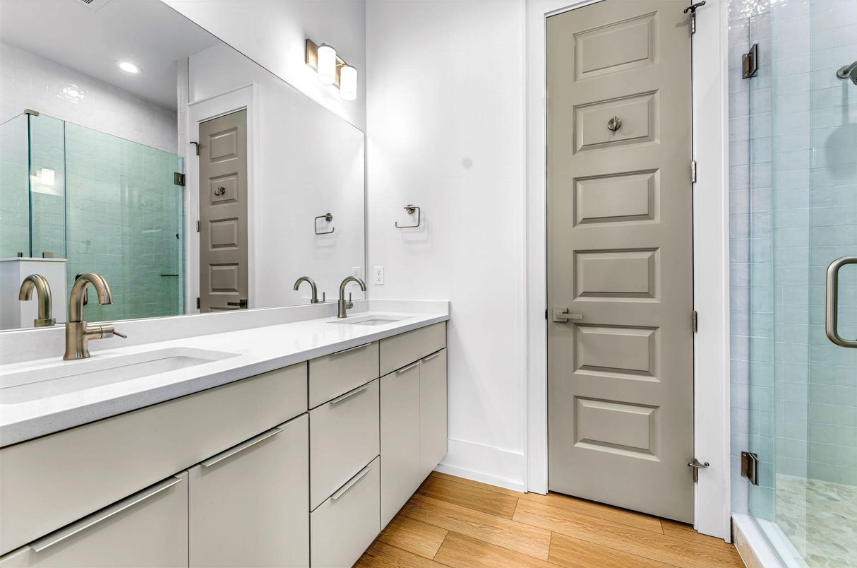 Bathroom, Dual Sink Vanities, Glass Shower, Interior, Recessed Lighting, Wood Texture Flooring