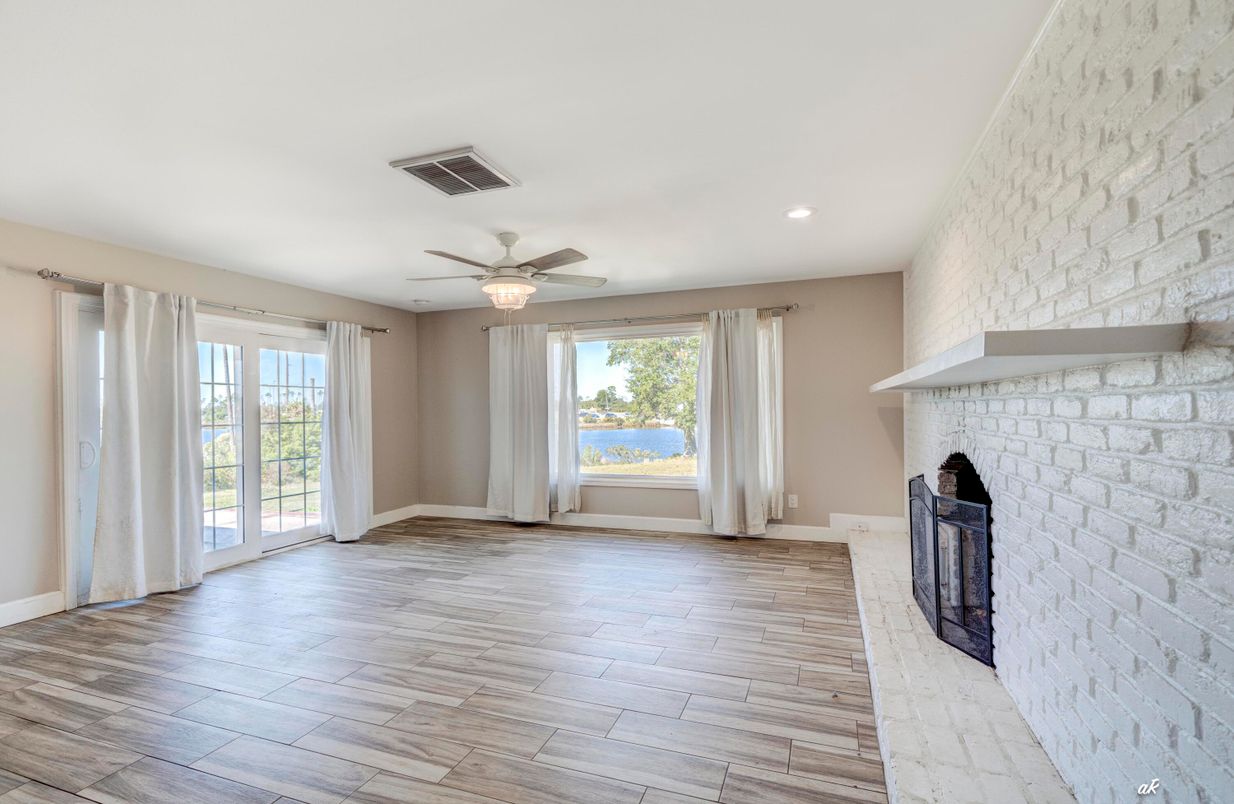 Empty room, Fireplace, Interior, Recessed Lighting, Stone Walls, Wood Texture Flooring