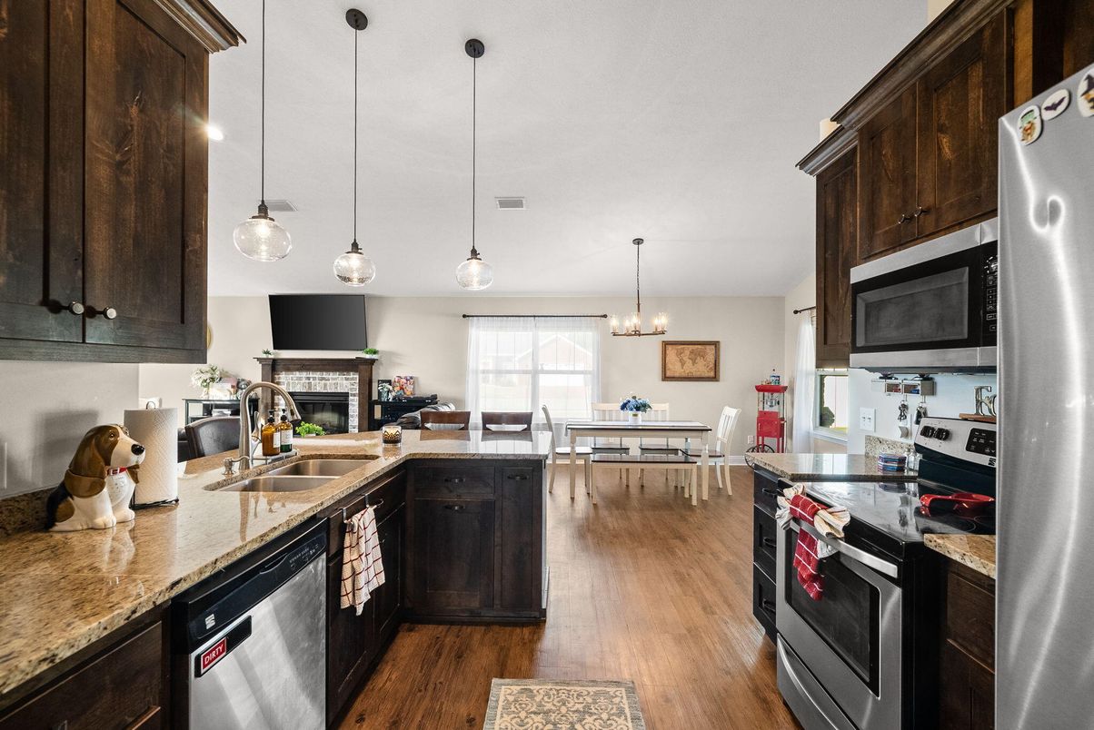 Chandelier, Dining room, Fireplace, Interior, Kitchen, Pendant Lights, Wood Texture Flooring