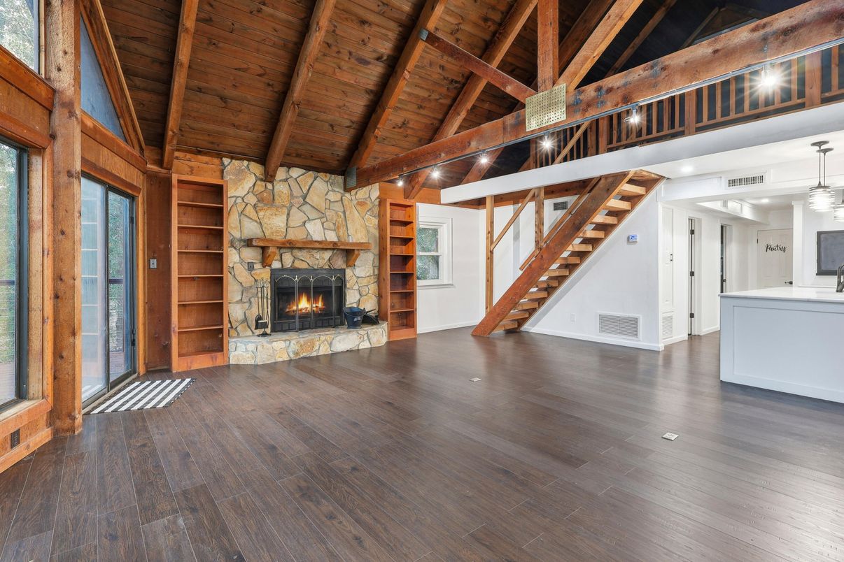 Empty room, Fireplace, Interior, Pendant Lights, Stone Walls, Wooden Beams, Wooden Ceilings, Wood Texture Flooring