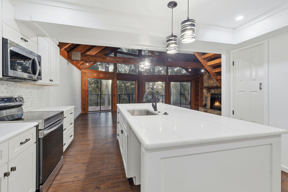 Fireplace, Interior, Kitchen, Pendant Lights, Recessed Lighting, Stainless Steel Appliances, Wooden Beams, Wooden Ceilings, Wood Texture Flooring