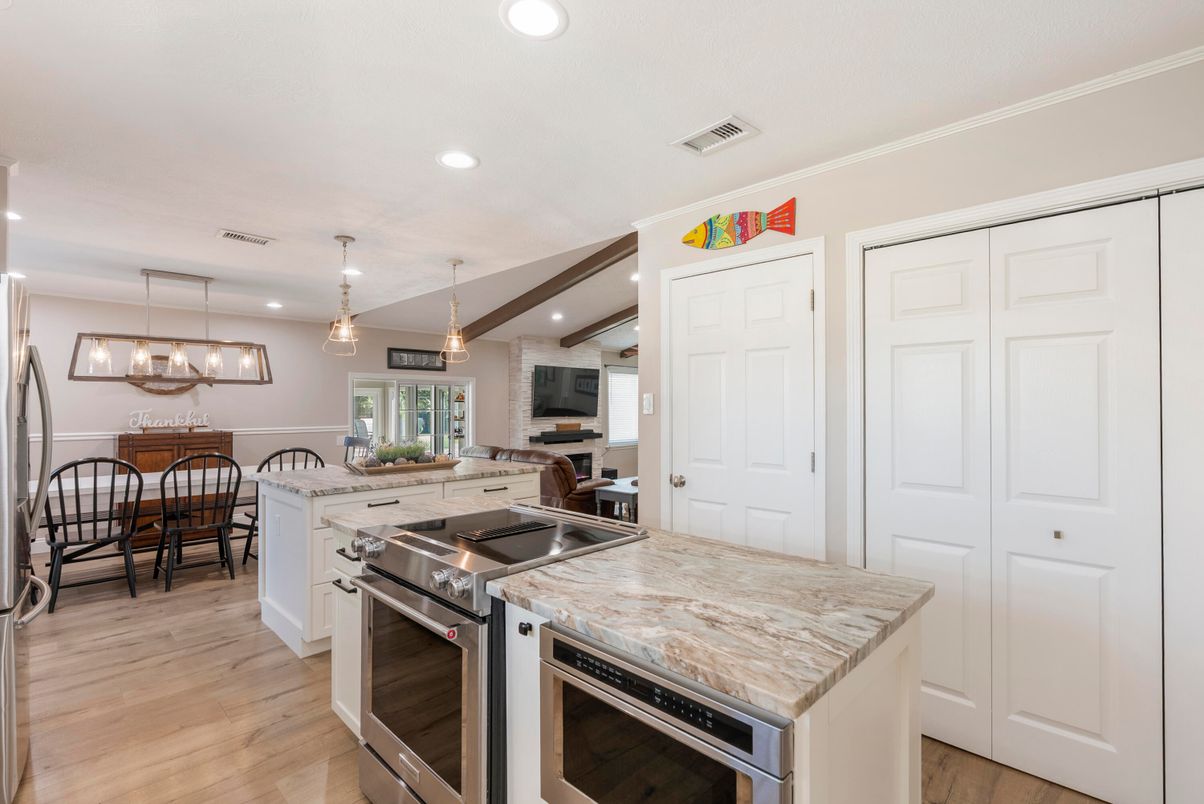 Dining room, Interior, Kitchen, Pendant Lights, Recessed Lighting, Stainless Steel Appliances, Wood Texture Flooring