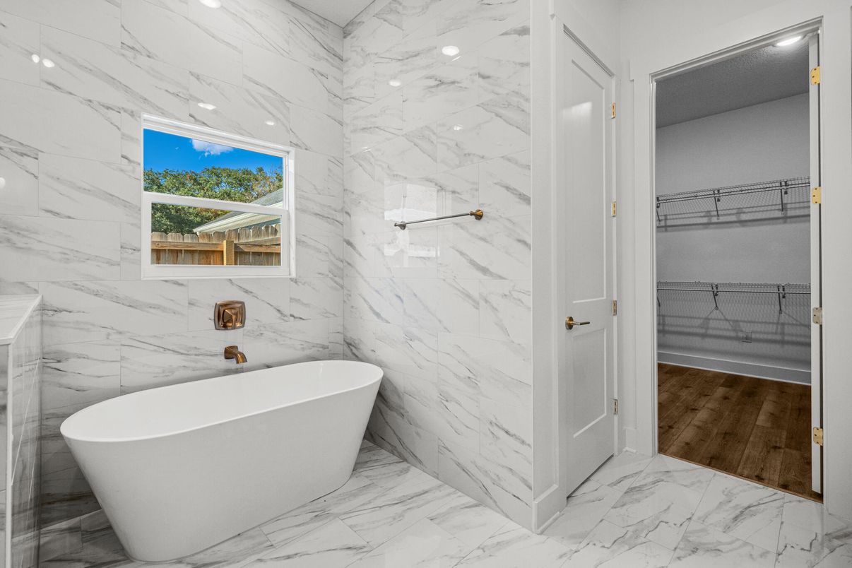Bathroom, Free Standing Baths, Interior, Marble, Marble Walls, Recessed Lighting, Wood Texture Flooring