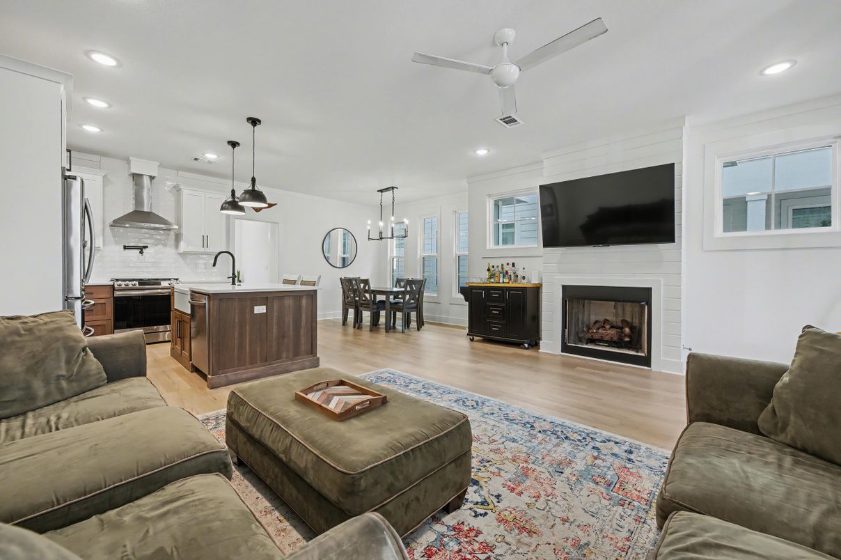 Chandelier, Dining room, Fireplace, Interior, Kitchen, Living room, Pendant Lights, Recessed Lighting, Stainless Steel Appliances, Wood Texture Flooring