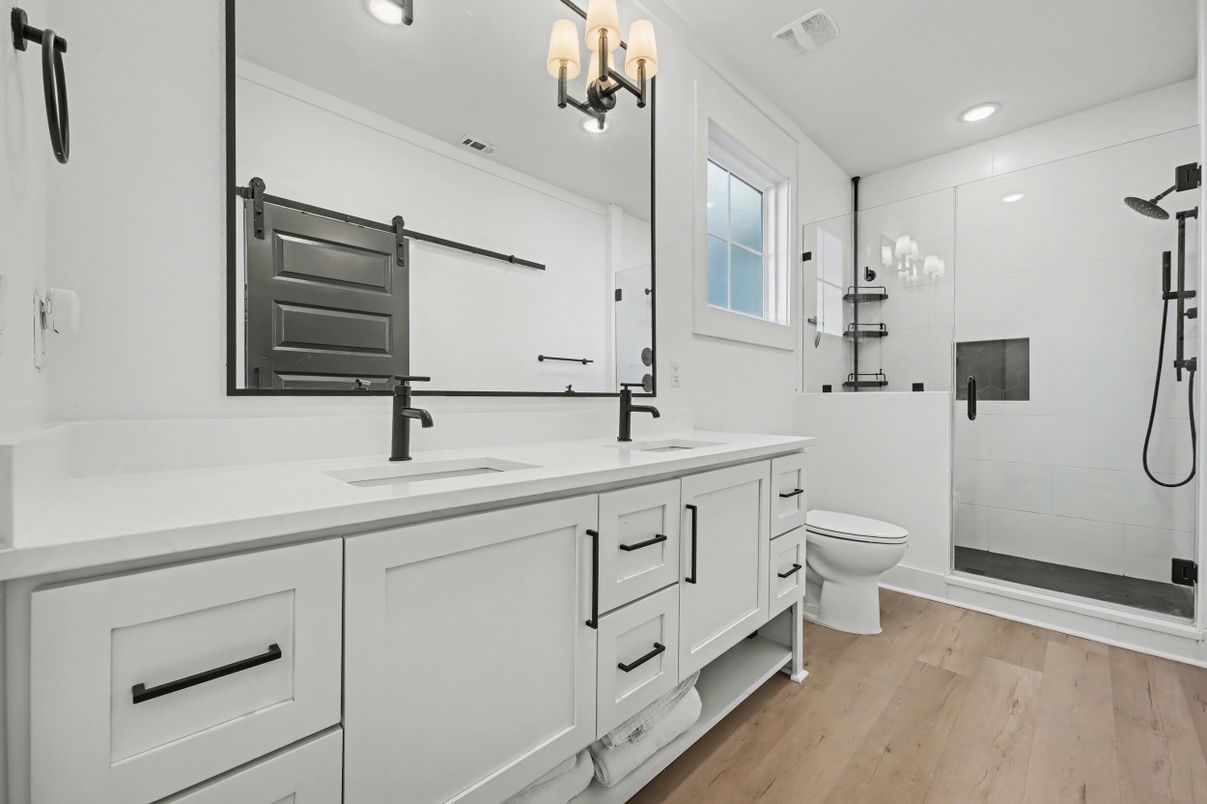 Bathroom, Dual Sink Vanities, Glass Shower, Interior, Recessed Lighting, Wood Texture Flooring