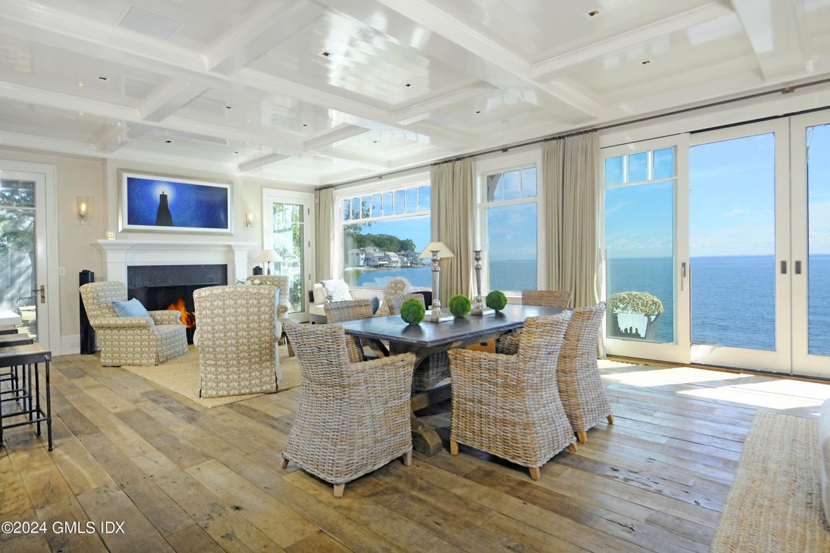 Dining room, Fireplace, Interior, Living room, Recessed Lighting, Water, Wood Texture Flooring