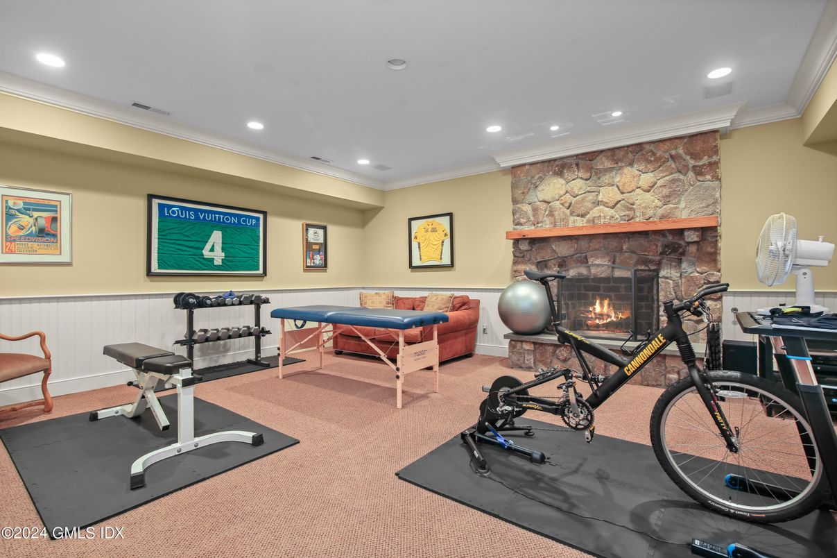 Fireplace, Fitness Equipment, Interior, Recessed Lighting, Stone Walls