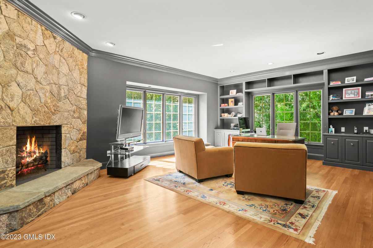Fireplace, Home Office, Interior, Living room, Recessed Lighting, Stone Walls, Wood Texture Flooring