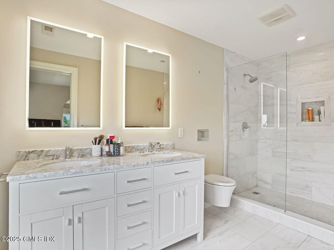 Bathroom, Dual Sink Vanities, Glass Shower, Interior, Marble, Marble Walls, Recessed Lighting