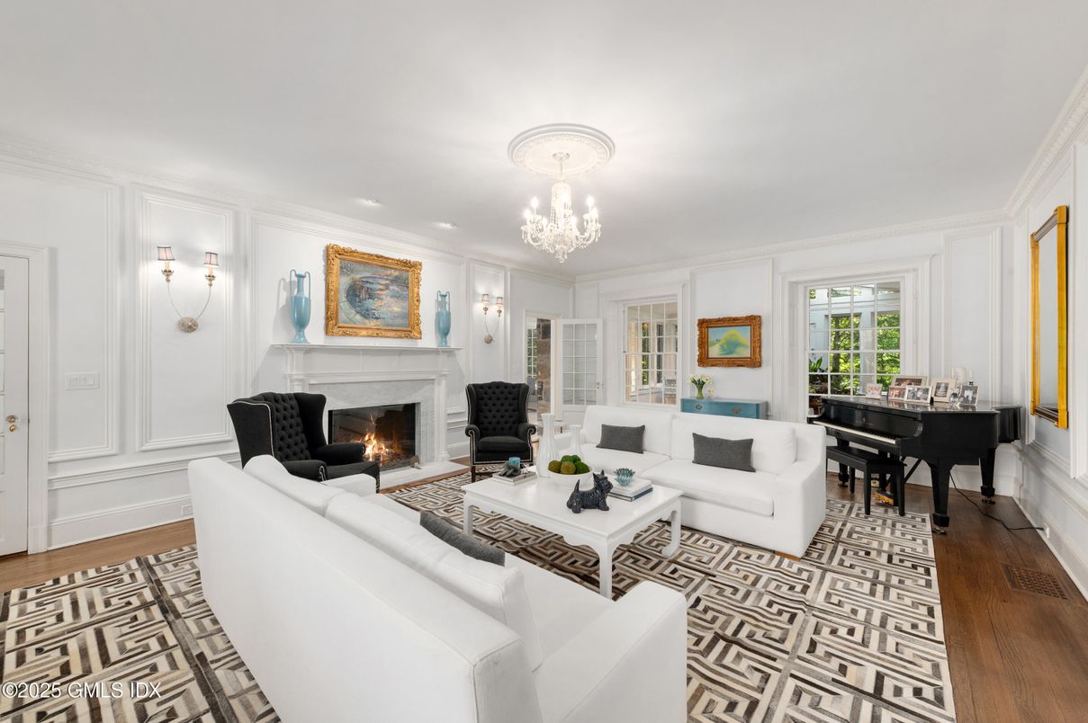 Chandelier, Fireplace, Interior, Living room, Piano, Recessed Lighting, Wood Texture Flooring