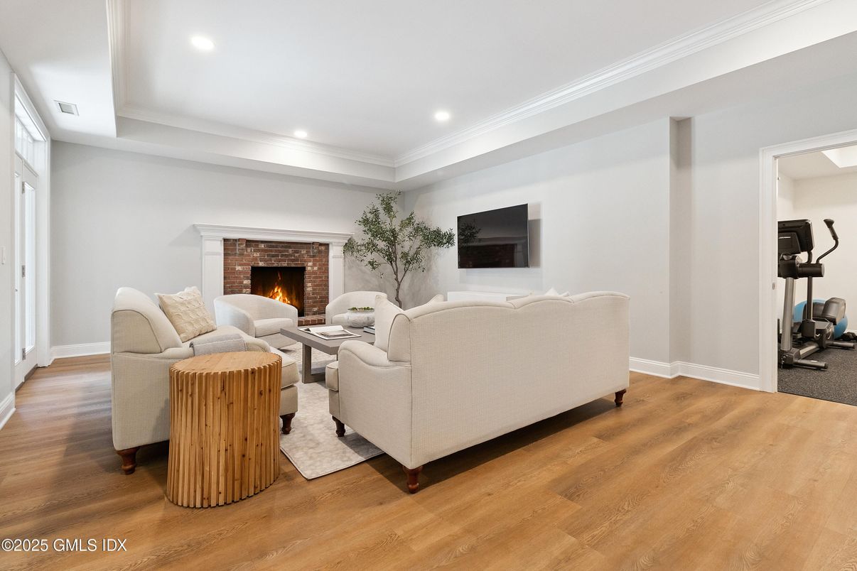 Fireplace, Fitness Equipment, Interior, Living room, Recessed Lighting, Wood Texture Flooring