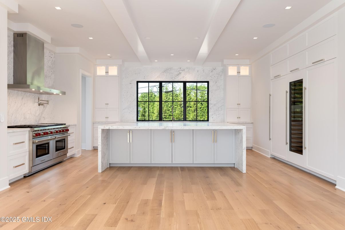 Interior, Kitchen, Marble Walls, Recessed Lighting, Stainless Steel Appliances, Wood Texture Flooring