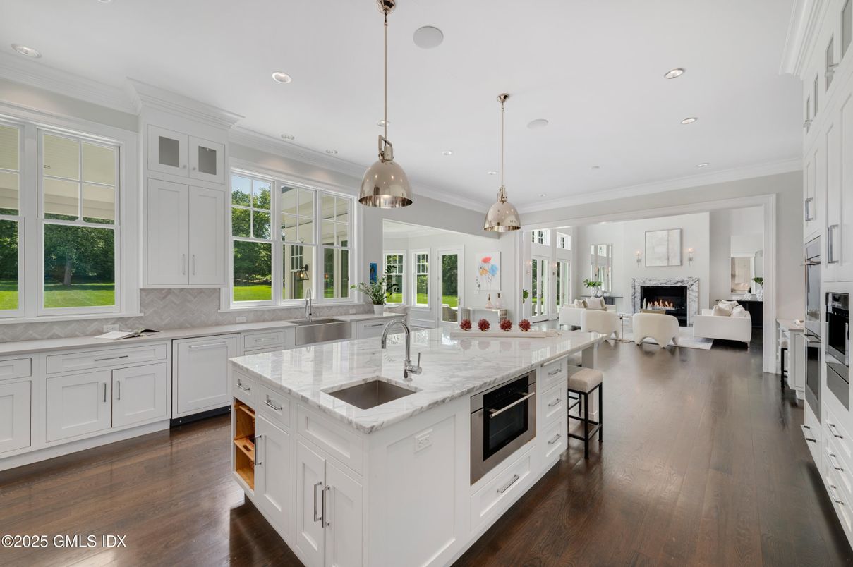 Fireplace, Interior, Kitchen, Living room, Pendant Lights, Recessed Lighting, Stainless Steel Appliances, Wood Texture Flooring