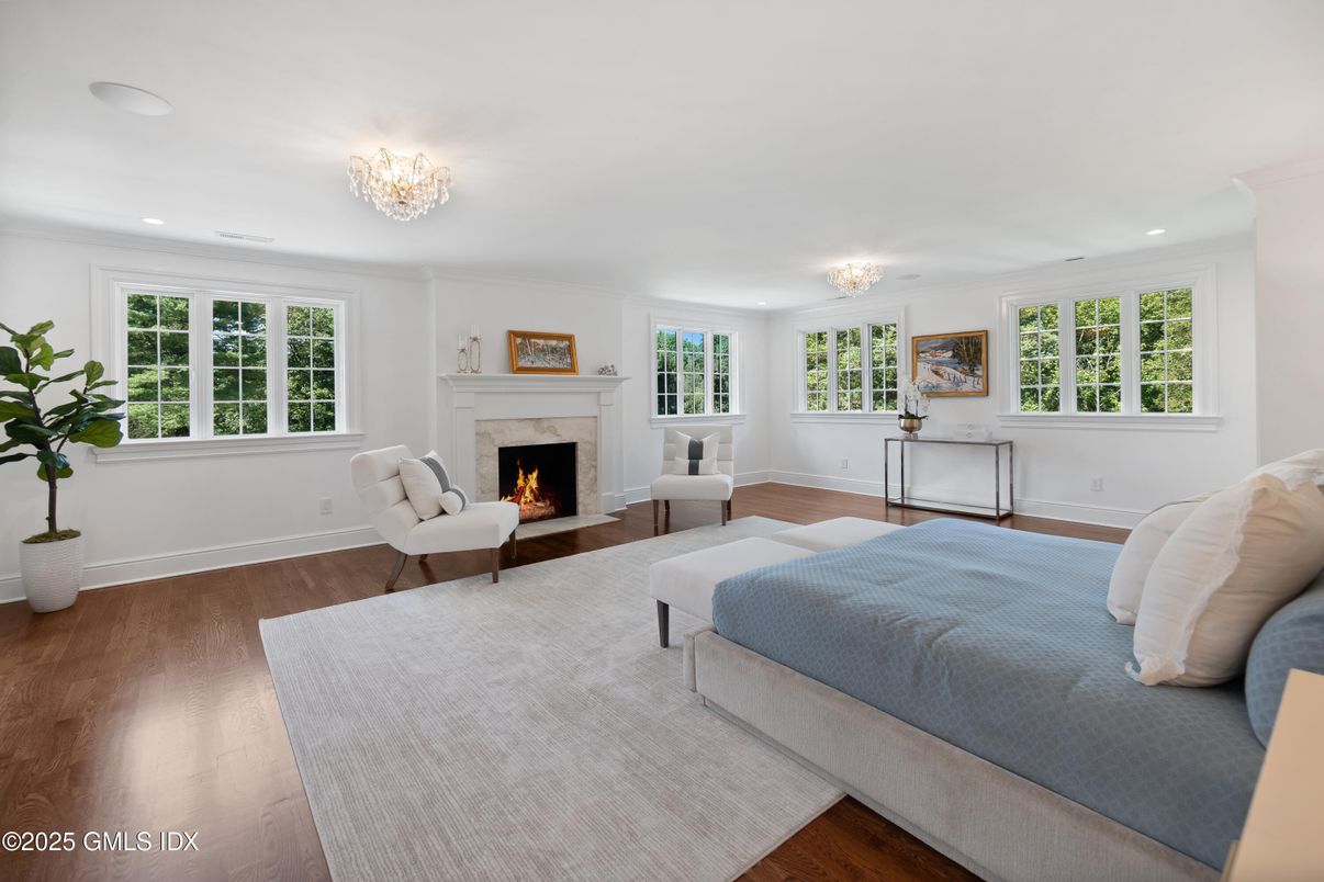 Bedroom, Chandelier, Fireplace, Interior, Recessed Lighting, Wood Texture Flooring