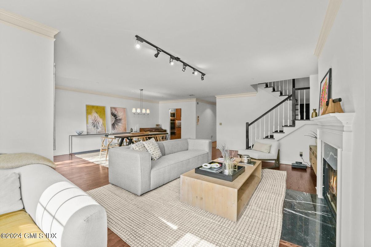 Chandelier, Dining room, Fireplace, Interior, Living room, Pendant Lights, Wood Texture Flooring
