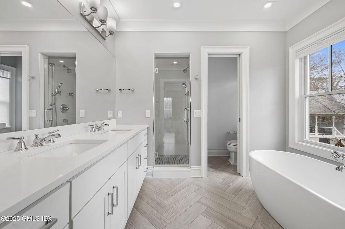 Bathroom, Dual Sink Vanities, Free Standing Baths, Glass Shower, Interior, Recessed Lighting, Wood Texture Flooring