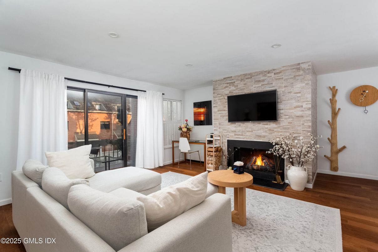 Fireplace, Interior, Living room, Recessed Lighting, Stone Walls, Wood Texture Flooring