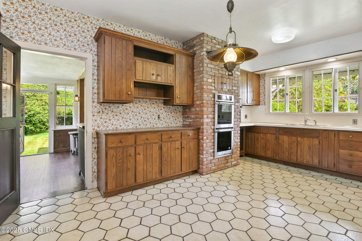Interior, Kitchen, Pendant Lights, Stainless Steel Appliances, Stone Walls, Wood Texture Flooring