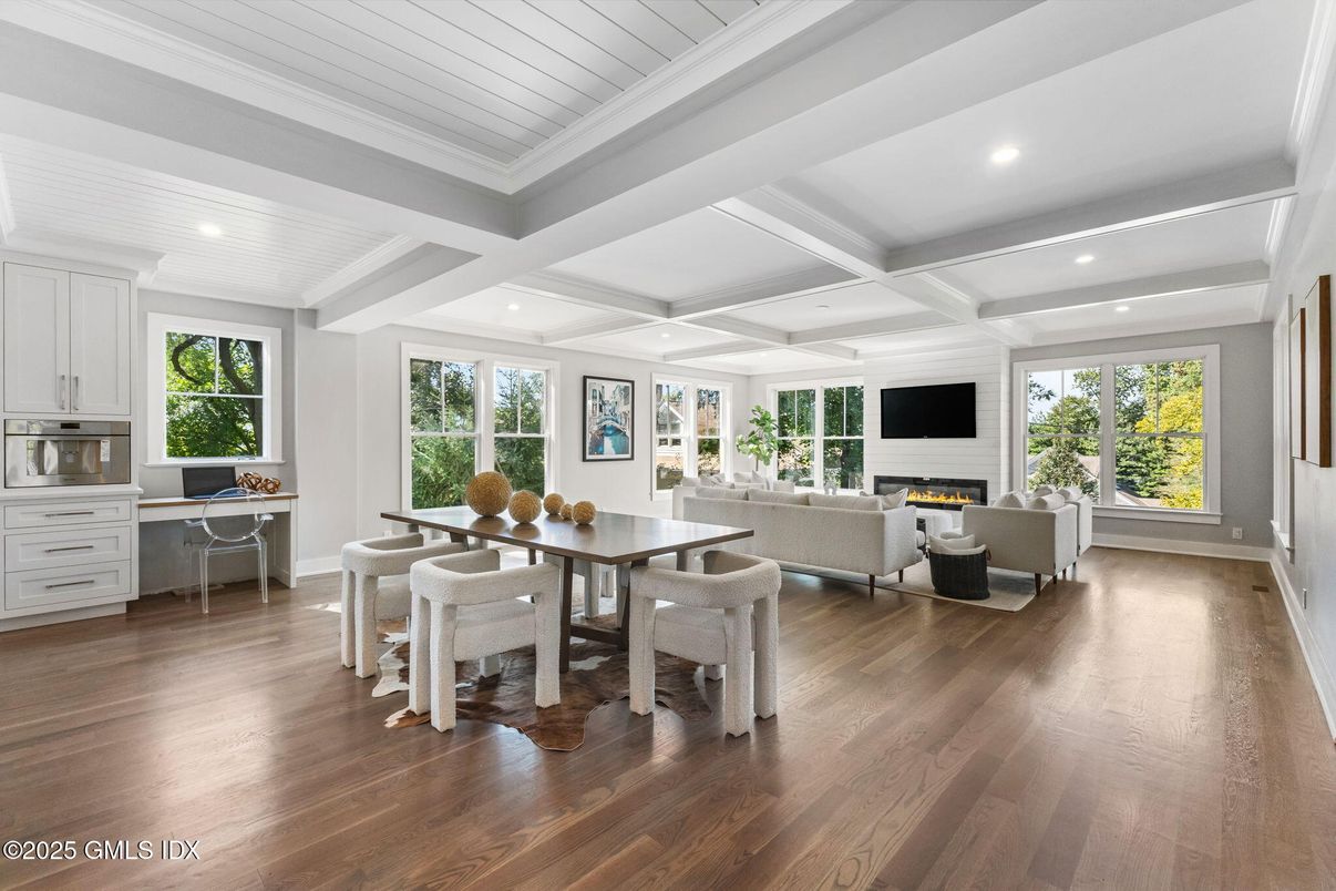 Dining room, Fireplace, Interior, Living room, Recessed Lighting, Wood Texture Flooring