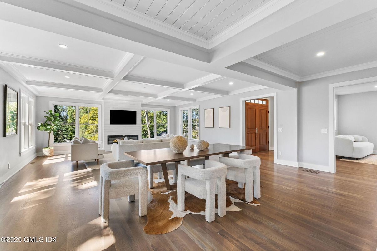 Dining room, Fireplace, Interior, Living room, Recessed Lighting, Wood Texture Flooring