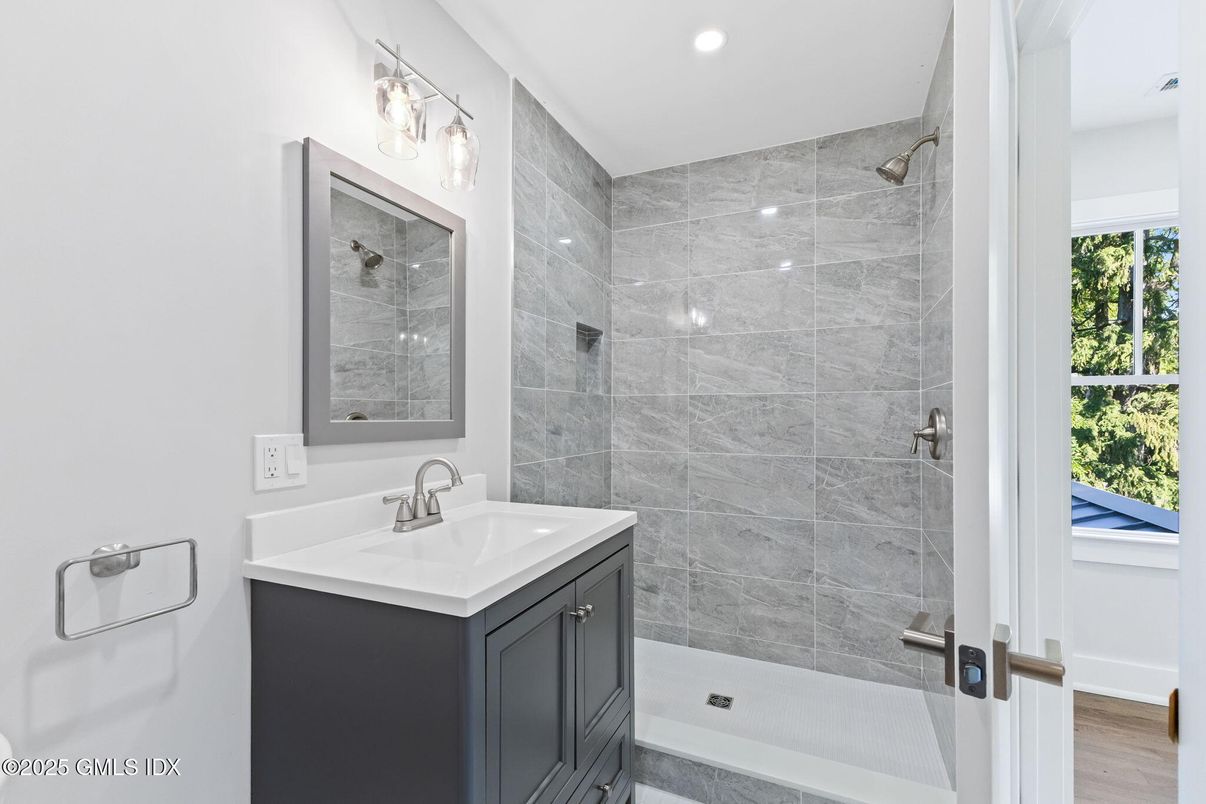 Bathroom, Glass Shower, Interior, Marble Walls, Recessed Lighting, Wood Texture Flooring