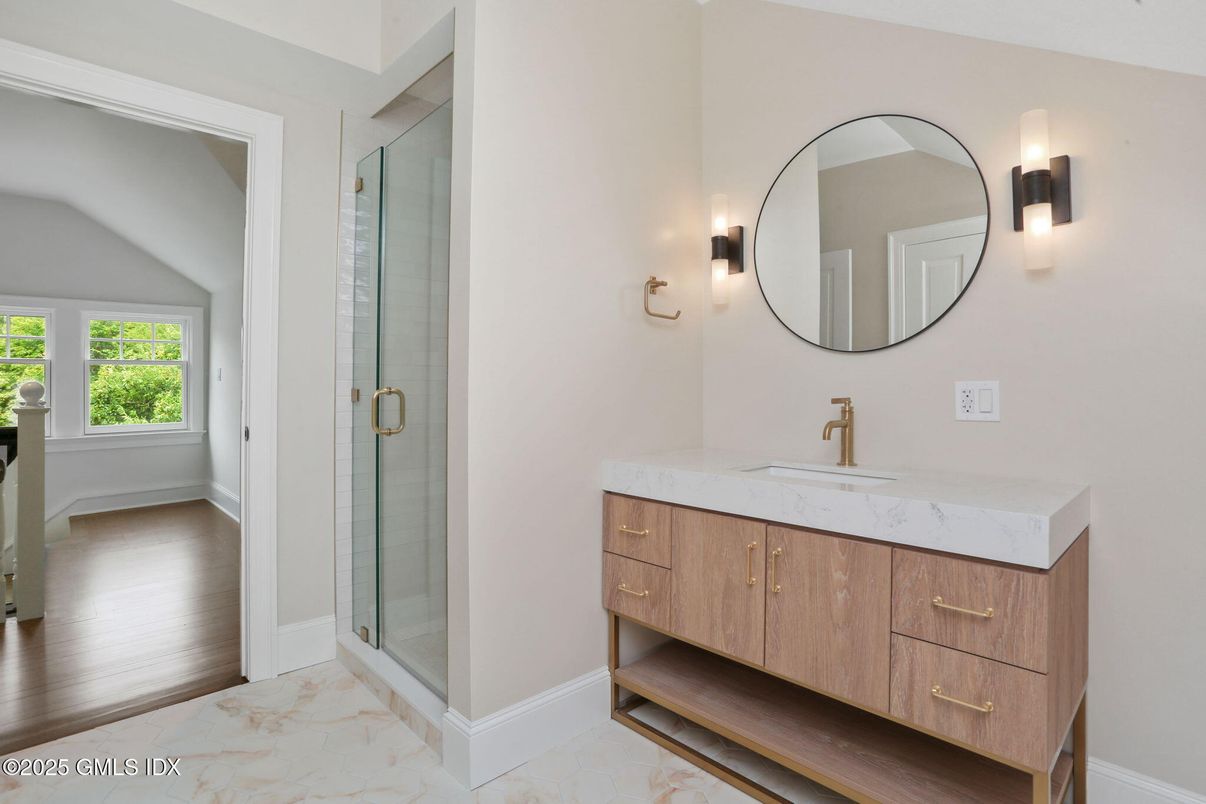 Bathroom, Dual Sink Vanities, Glass Shower, Interior, Marble, Wood Texture Flooring