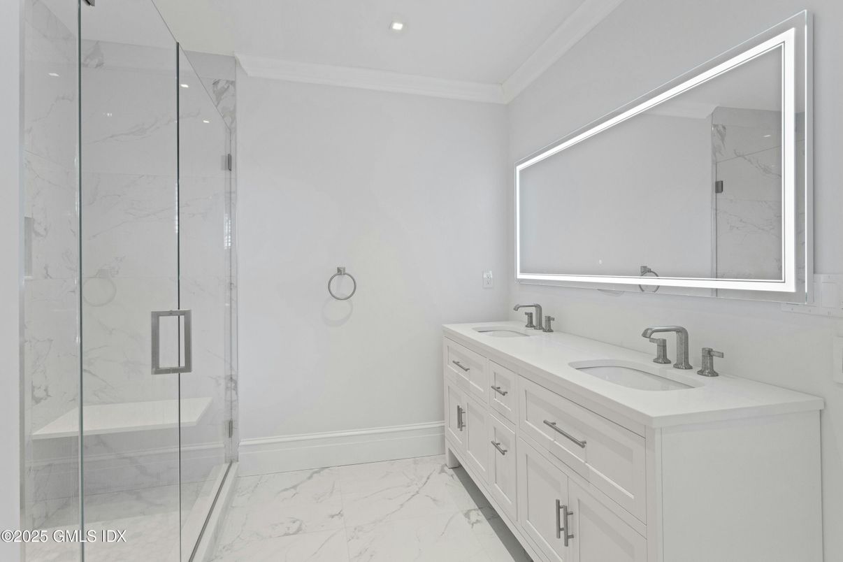Bathroom, Dual Sink Vanities, Glass Shower, Interior, Marble, Marble Walls, Recessed Lighting