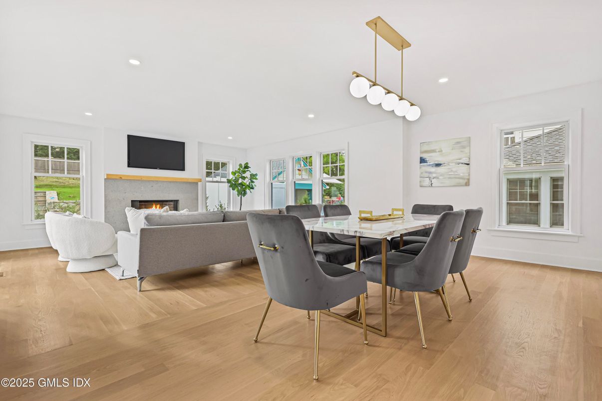 Dining room, Fireplace, Interior, Living room, Pendant Lights, Recessed Lighting, Wood Texture Flooring