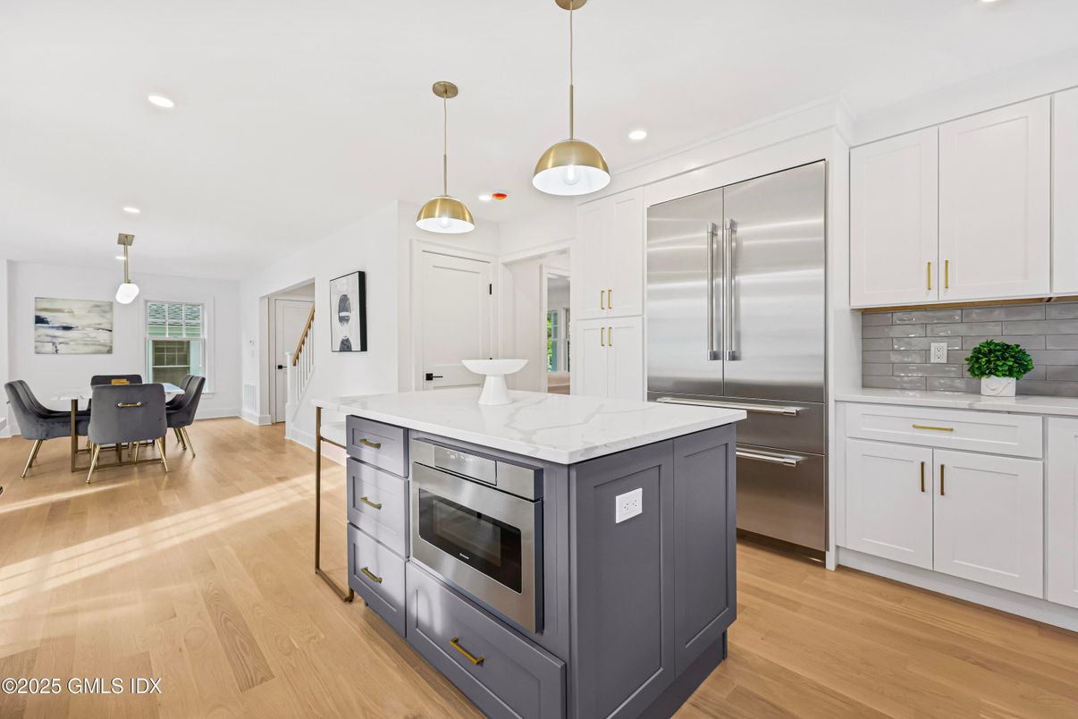 Dining room, Interior, Kitchen, Pendant Lights, Recessed Lighting, Stainless Steel Appliances, Wood Texture Flooring