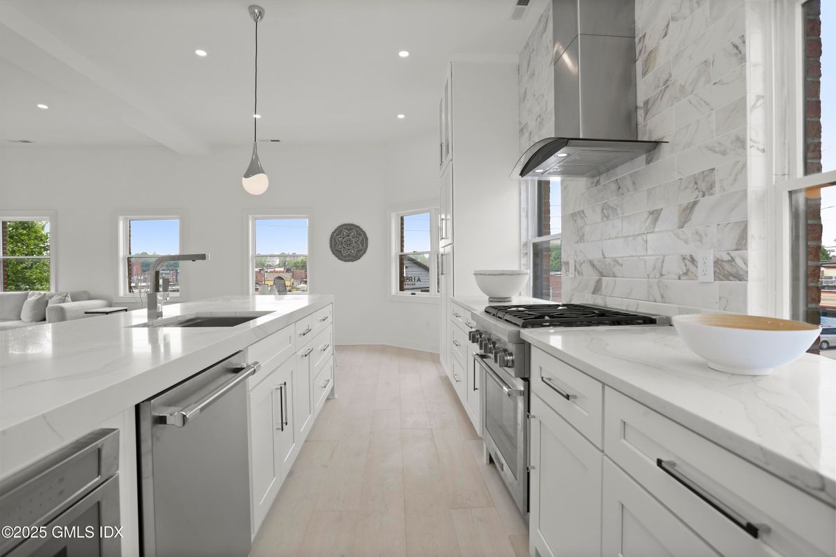 Interior, Kitchen, Marble Walls, Pendant Lights, Recessed Lighting, Stainless Steel Appliances, Wood Texture Flooring