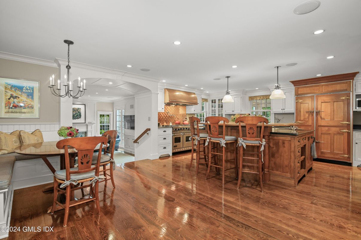 Chandelier, Dining room, Interior, Kitchen, Pendant Lights, Recessed Lighting, Stainless Steel Appliances, Wood Texture Flooring