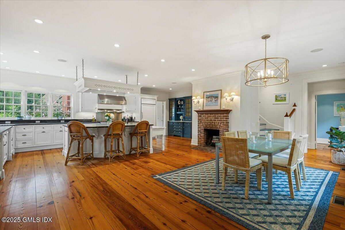 Chandelier, Dining room, Fireplace, Interior, Kitchen, Pendant Lights, Recessed Lighting, Wood Texture Flooring