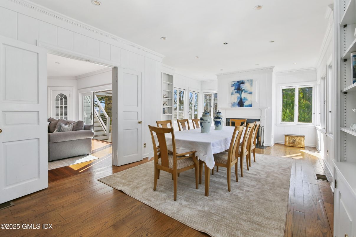Dining room, Fireplace, Interior, Living room, Recessed Lighting, Wood Texture Flooring