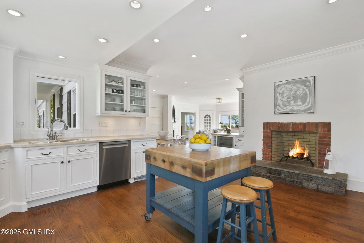 Fireplace, Interior, Kitchen, Recessed Lighting, Stainless Steel Appliances, Wood Texture Flooring