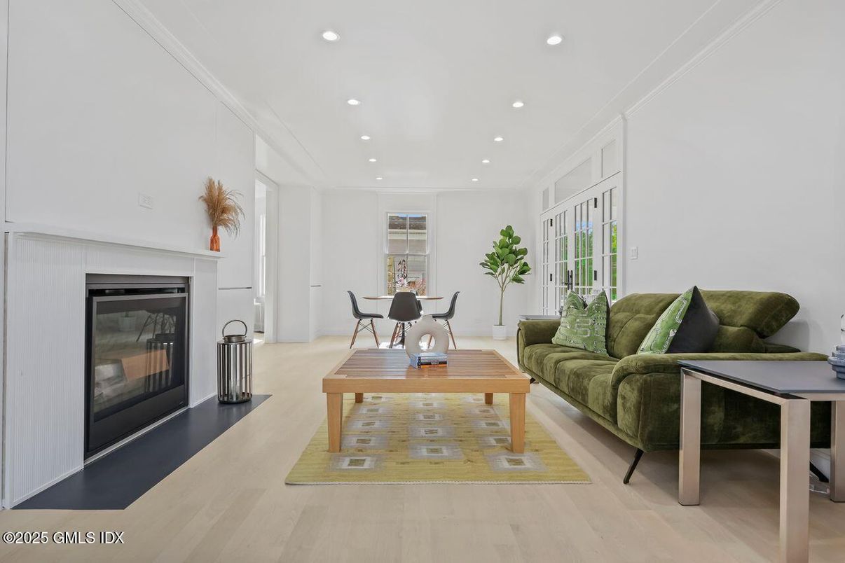 Dining room, Fireplace, Interior, Living room, Recessed Lighting, Wood Texture Flooring