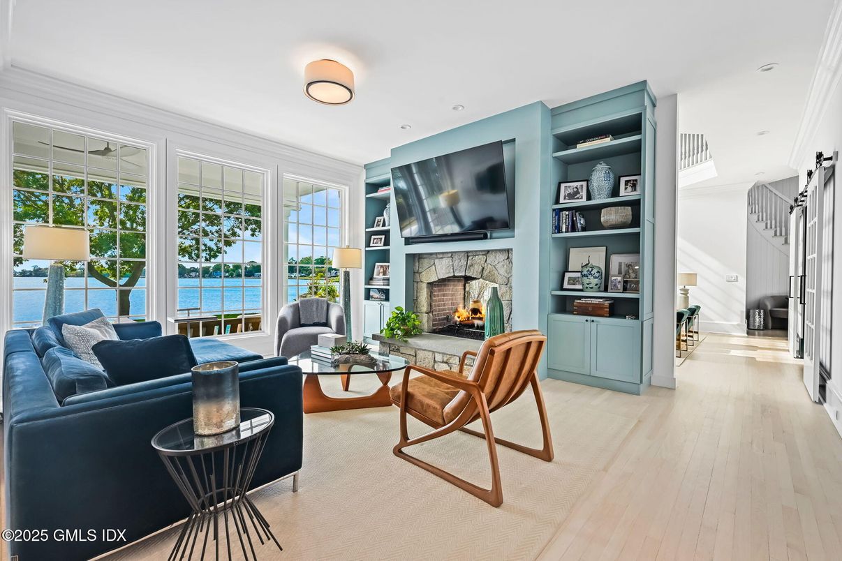 Fireplace, Interior, Living room, Recessed Lighting, Water, Wood Texture Flooring