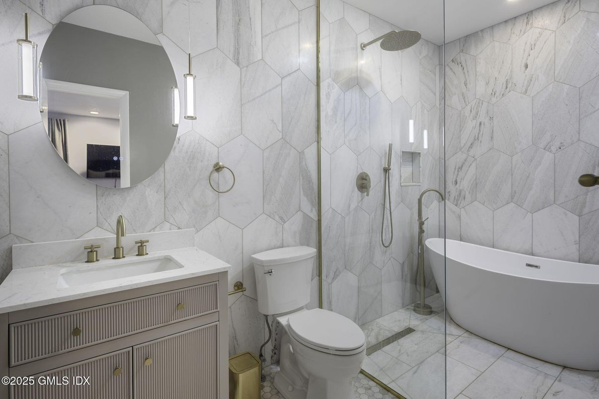 Bathroom, Free Standing Baths, Glass Shower, Interior, Marble, Marble Walls, Recessed Lighting