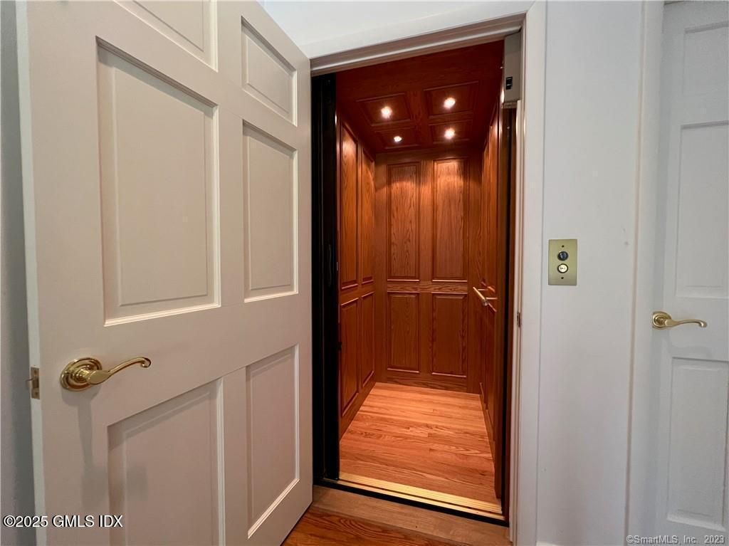 Elevator, Interior, Recessed Lighting, Wooden Ceilings, Wood Texture Flooring, Wooden Walls
