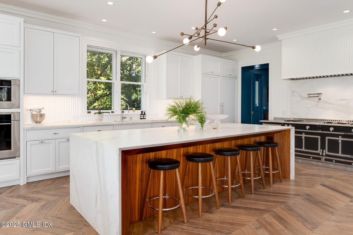 Interior, Kitchen, Marble Walls, Pendant Lights, Recessed Lighting, Stainless Steel Appliances, Wood Texture Flooring