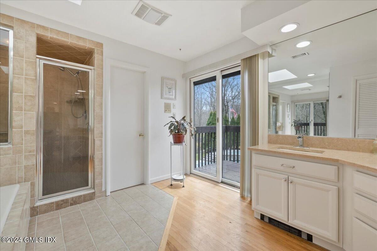 Bathroom, Glass Shower, Interior, Recessed Lighting, Wood Texture Flooring