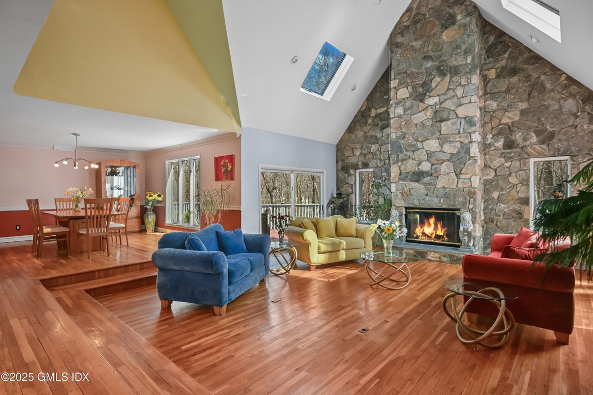 Dining room, Fireplace, Interior, Living room, Pendant Lights, Stone Walls, Wood Texture Flooring