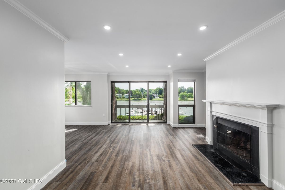 Empty room, Fireplace, Interior, Recessed Lighting, Water, Wood Texture Flooring