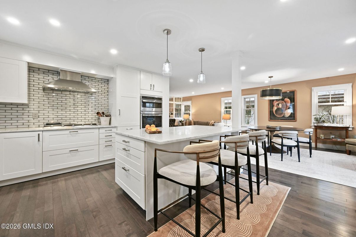 Dining room, Interior, Kitchen, Pendant Lights, Recessed Lighting, Stainless Steel Appliances, Wood Texture Flooring